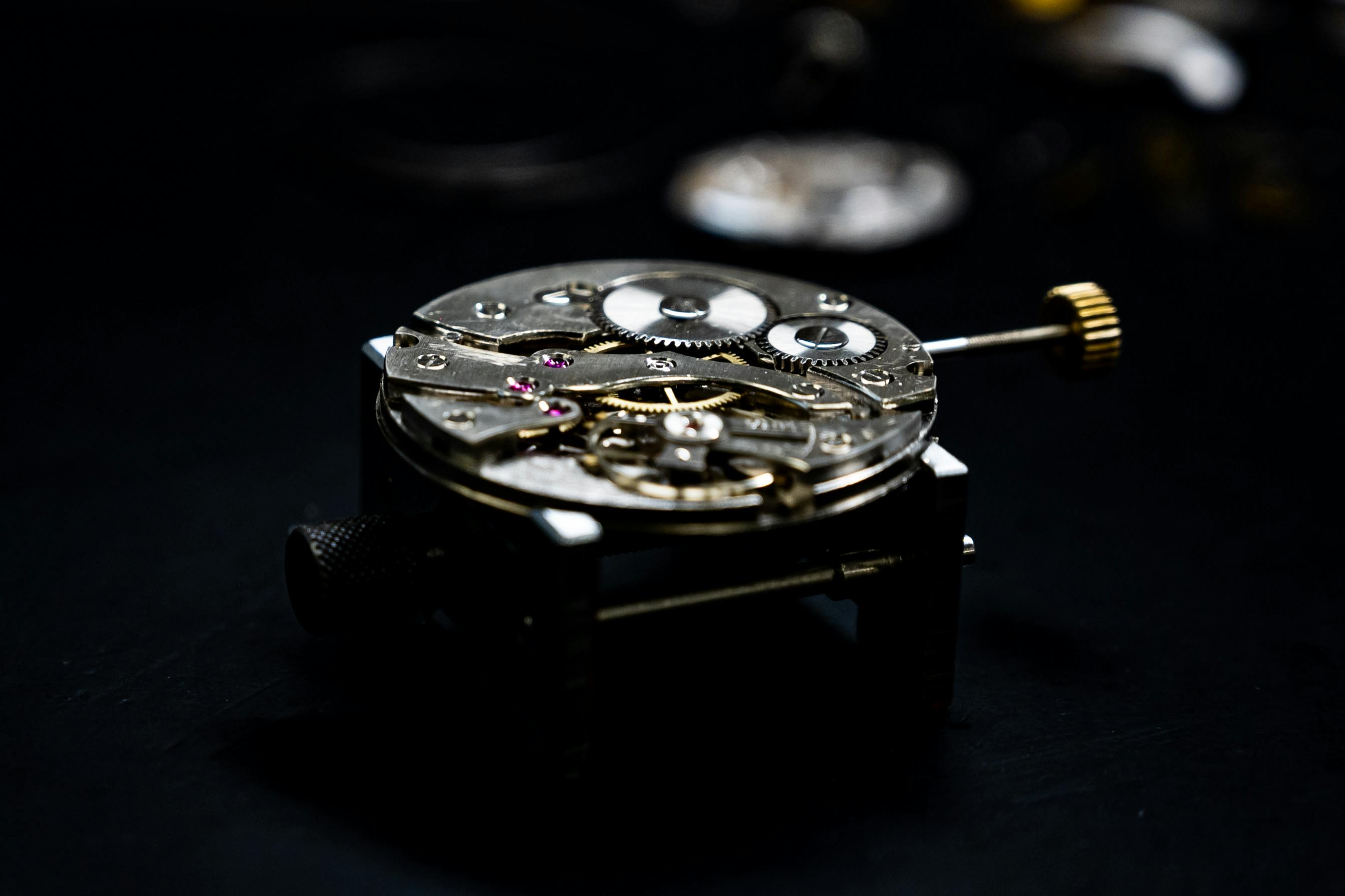 A fine dress watch on a workshop bench